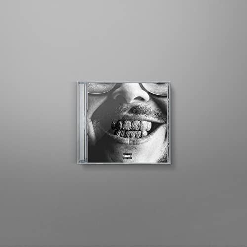 Black and white CD case featuring a close-up of a smiling man’s face.