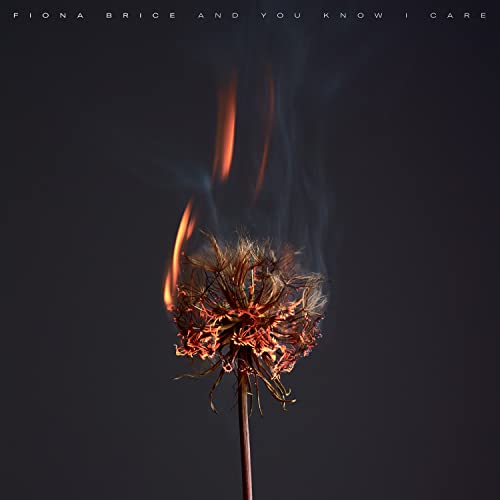 Album cover: burning flower against a dark, smoky background.