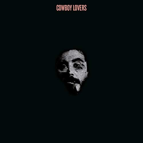Dark album cover featuring a grainy, close-up portrait of a man.