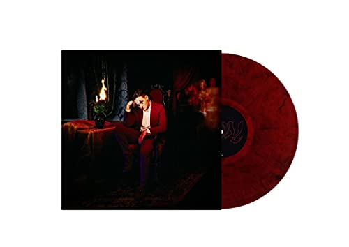 Vinyl record and album cover featuring a person in a red suit.
