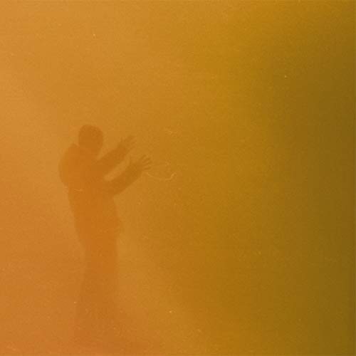 Silhouetted figure with hands raised against a warm, orange background.
