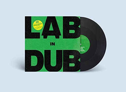 Green album cover with bold black text and a black vinyl record.