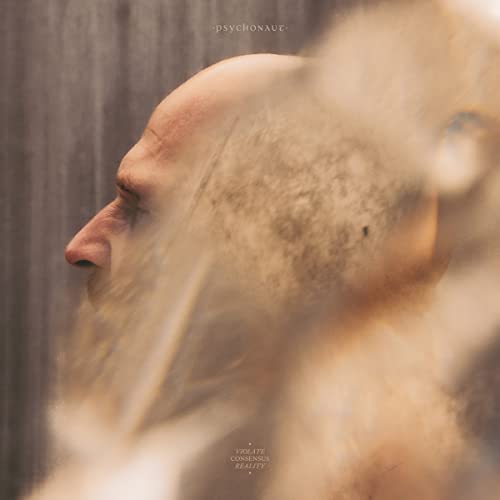 CD cover: a man’s profile dissolving into blurry, golden textures.