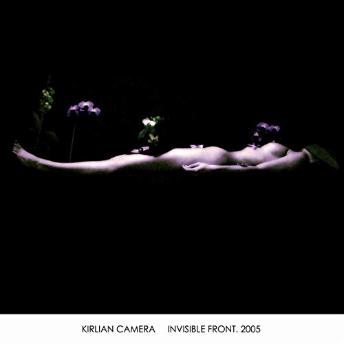 Dark album cover with a nude figure lying among purple flowers.