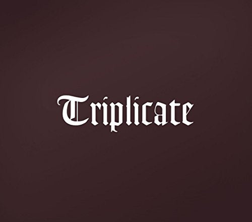 Bob Dylan’s “Triplicate” album cover: ornate white text on dark maroon.