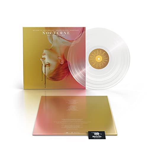 Vinyl record with cover art featuring a face and golden sun design.