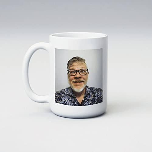 White mug with a portrait of Dolph Chaney, a man with glasses and a beard.