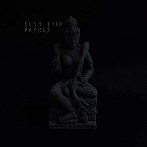 Dark album cover featuring a stone statue of a seated figure.