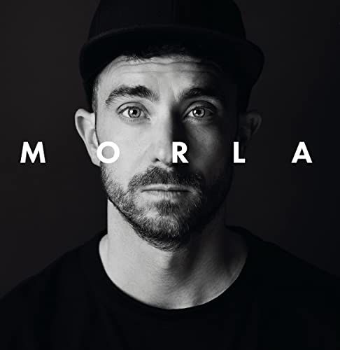 Black and white portrait of a man with a cap, album cover.