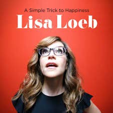 "Album cover: Lisa Loeb against a red background, wearing glasses and a black top."