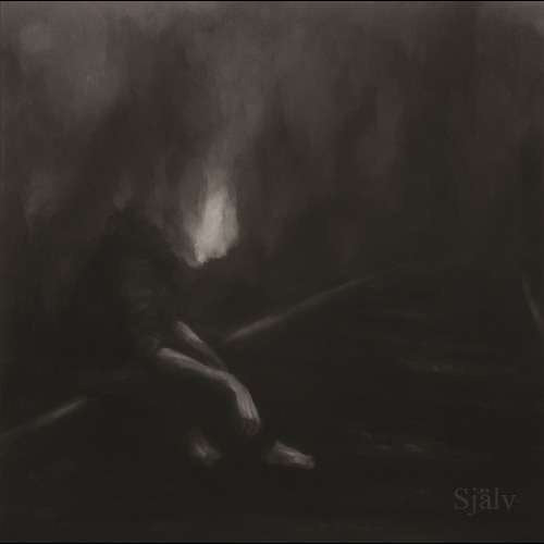 Dark, blurry image of a figure with outstretched arms, album cover.