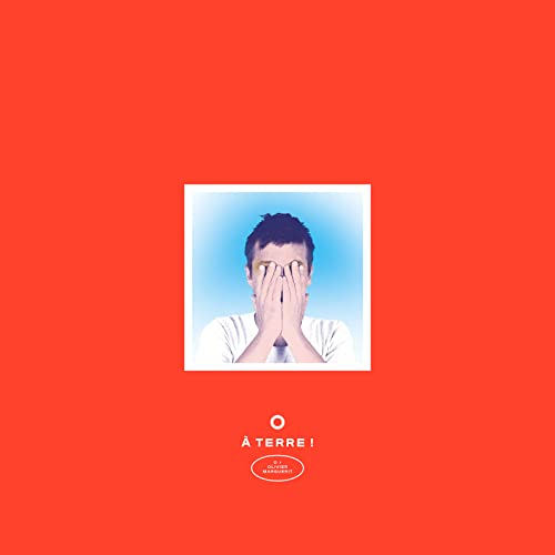 Record cover: man covering face with hands, red and blue tones.
