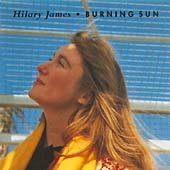 Album cover for Hilary James' "Burning Sun" featuring a woman in a yellow jacket.