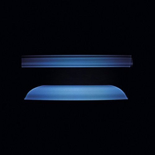 A blue vinyl record and its sleeve against a black background.