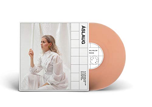Vinyl record with peach-colored disc and white cover featuring a woman in white.