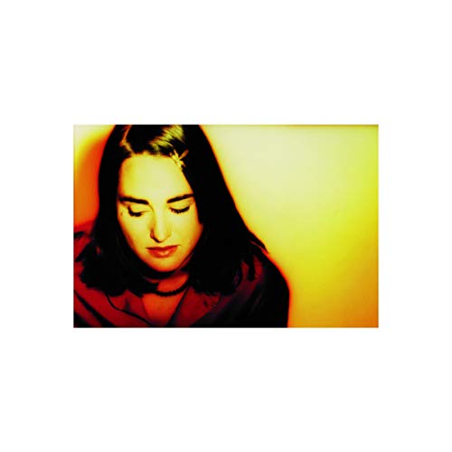 The alt text for the image is: "CD cover featuring a woman with dark hair, eyes closed."