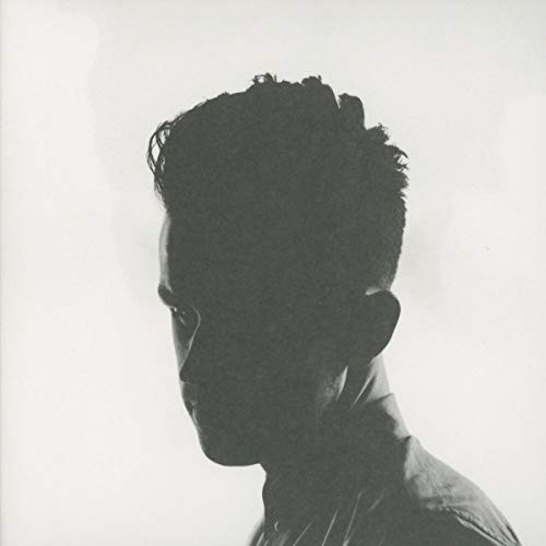 Black and white portrait of a man in profile, looking left.
