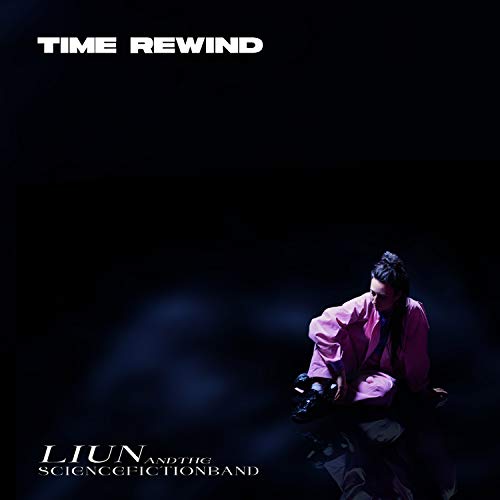 CD cover: person in pink suit sits with vintage camera, dark background.