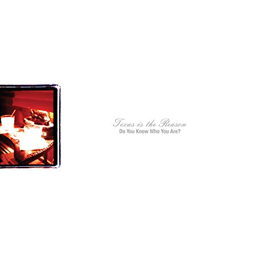 "Vinyl record cover with a red-toned photograph and cursive text on a white background."