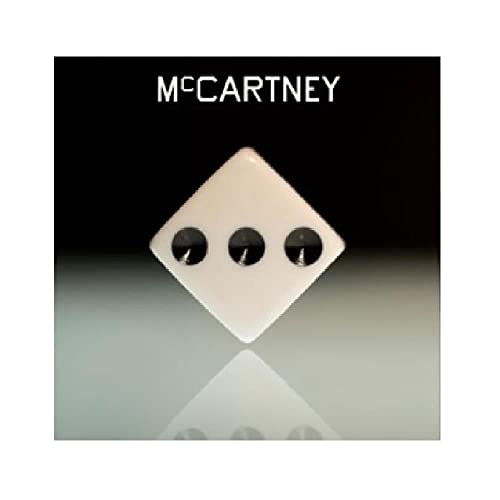 McCartney III album cover: black background with a white diamond and dots.