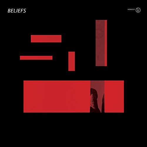 "Album cover with red rectangles on a black background, featuring a partial portrait."