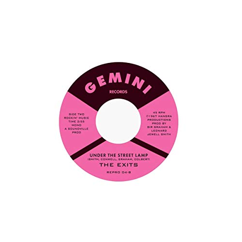 Pink and black 7-inch vinyl record label with text details.