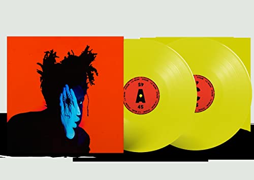 Album cover art with a person on orange background next to two yellow vinyls.