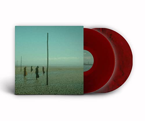 Vinyl record with red and black marbling, album cover showing figures in a landscape.