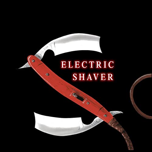 Silver and red electric shaver against a black background.
