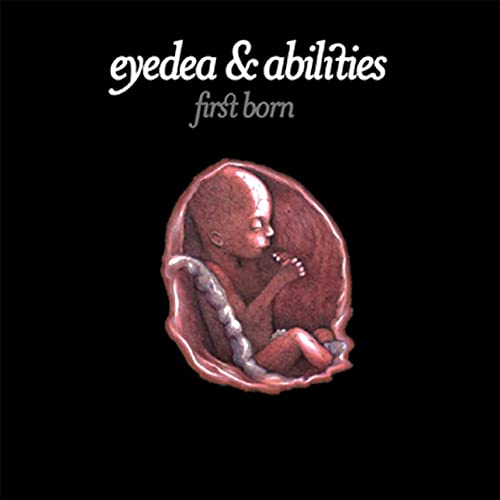 Album cover: fetal illustration within an oval frame, black background.