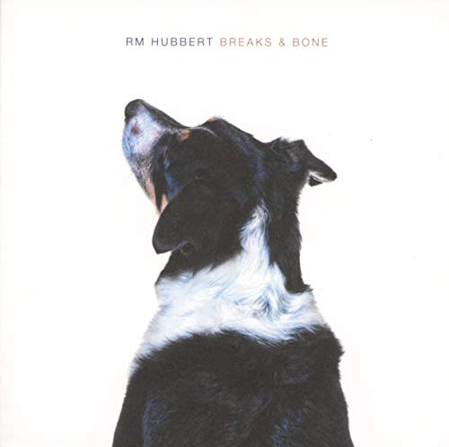 CD cover: black and white dog looking upwards, text above.