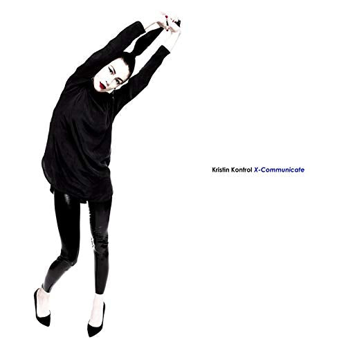 Woman in black outfit mid-jump against a white background.