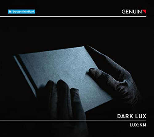 CD cover: a hand holding an open book in dim light.