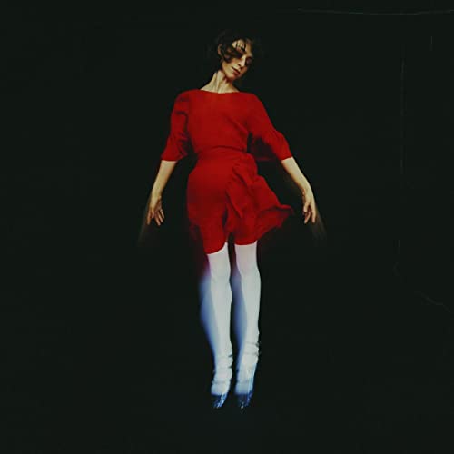 Jackie Cohen album cover: woman in red dress and white tights.