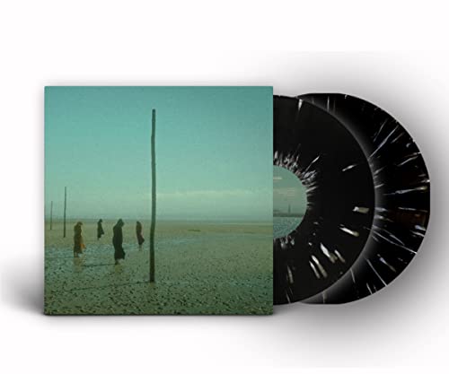 Vinyl record with cover art depicting figures in a misty landscape.