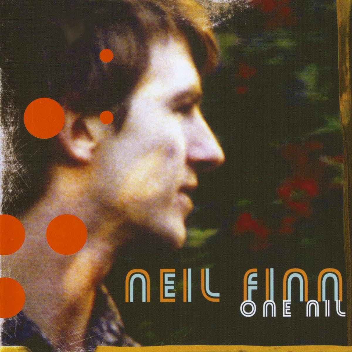 CD cover: profile of a man with orange circles and text.