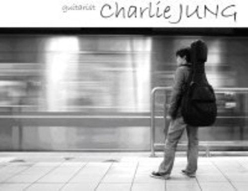 Black and white CD cover featuring a person with a guitar case.