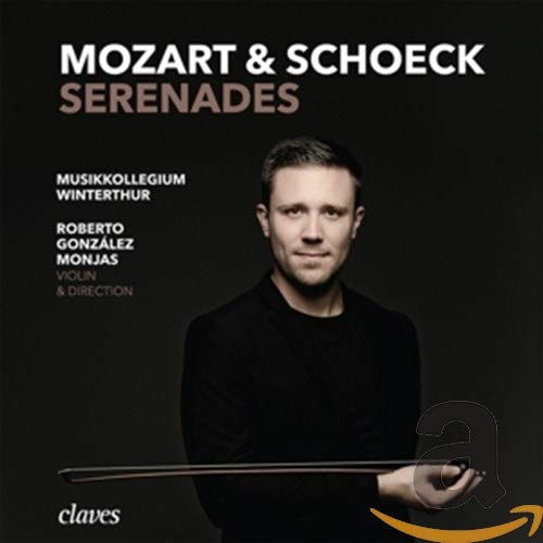 "CD cover featuring a man holding a conductor's baton against a black background."