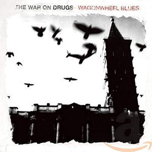 CD cover: black and white image of birds flying near a tower.