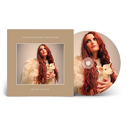 CD cover and disc featuring a woman with red hair and lambs.