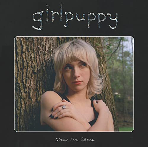 Album cover for Girlpuppy’s “When I’m Alone,” featuring a young woman.