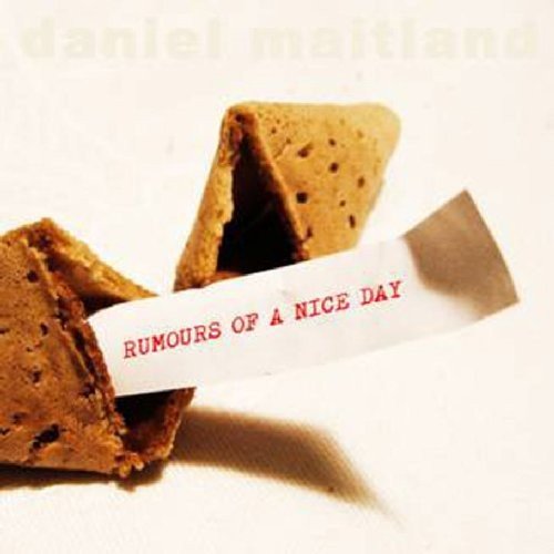 Album cover featuring broken fortune cookies with a slip reading "Rumours of a Nice Day".