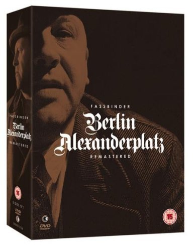 DVD case for "Berlin Alexanderplatz" with a sepia-toned image of a man's face.