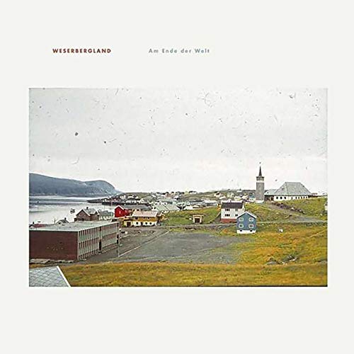 Vinyl album cover: coastal town with small houses and a church.