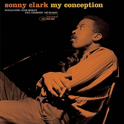 Sonny Clark album cover: portrait of a jazz pianist in orange tones.