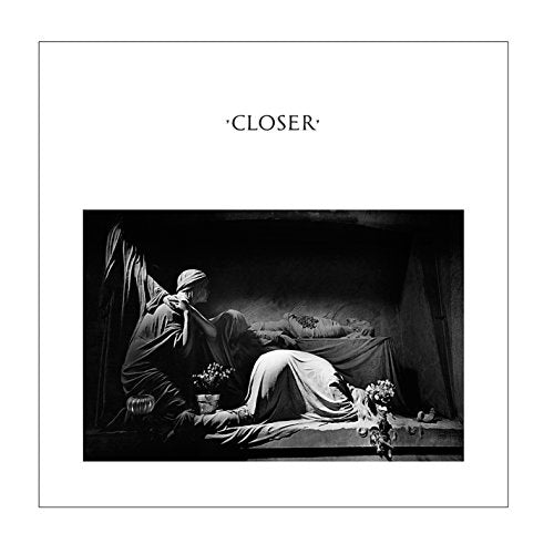 "Album cover with black and white image of a mourner beside a deceased person."