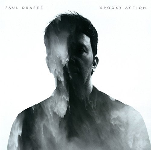 Album cover with a man's face and body obscured by smoke.