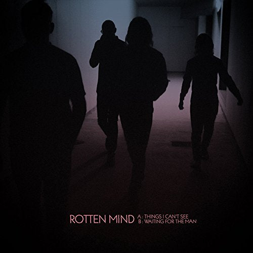 Album cover with silhouetted figures walking in a dimly lit hallway, text at the bottom.