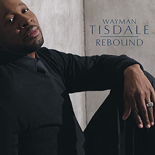 Wayman Tisdale portrait album cover, “Rebound,” featuring a smiling man in dark clothing.