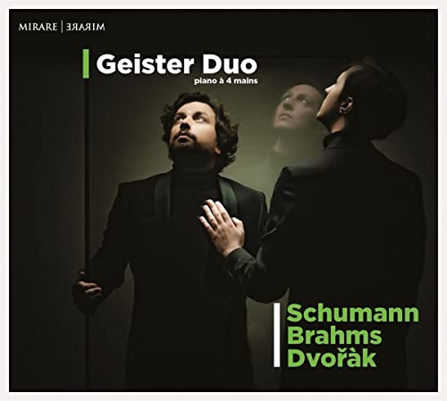 CD cover featuring two musicians in black suits with green accents.